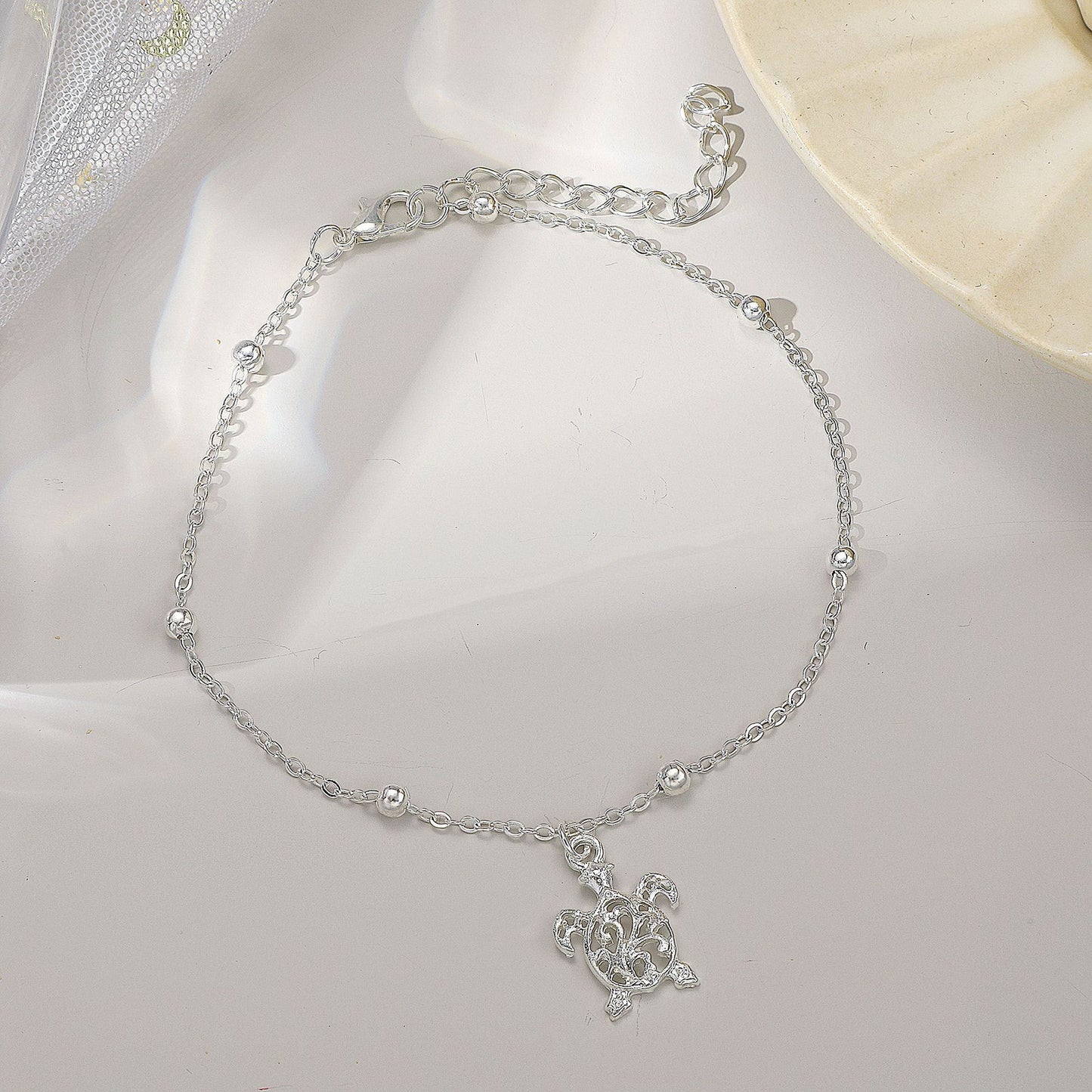 Tobillera Pequeña con Figura de Tortuga de Playa - Elegancia y Estilo Unisex- nexbuy.com.mx